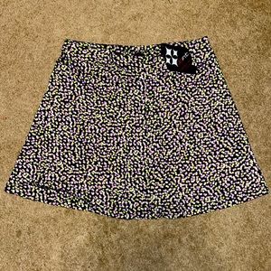 JoFit black golf skort with lime green, light pink and purple dots size medium